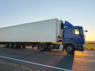 semi-truck-with-cargo-trailer-driving-on-highway-h-2024-12-06-11-28-15-utc.jpg